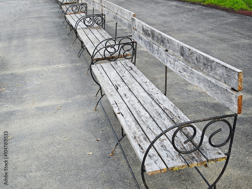 Vintage long bench wooden in park photo