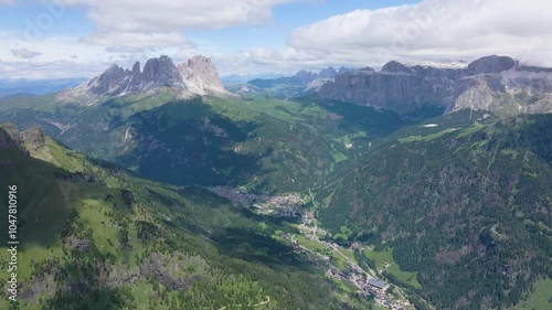 Drone aerial of Colac rocky mountain peak with people, Dolomites (Canazei). Via Ferrata dei Finanzieri. Sassolungo (Sasslong), Sella Pass and Pordoi background photo