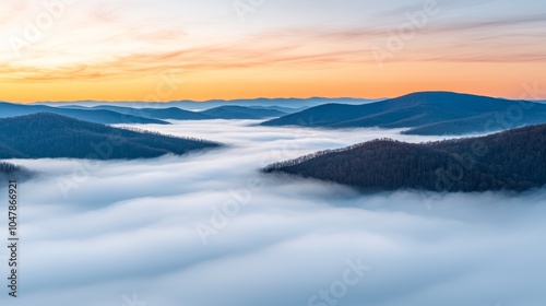 Fog Rolling Over a Serene Mountain Range at Dusk