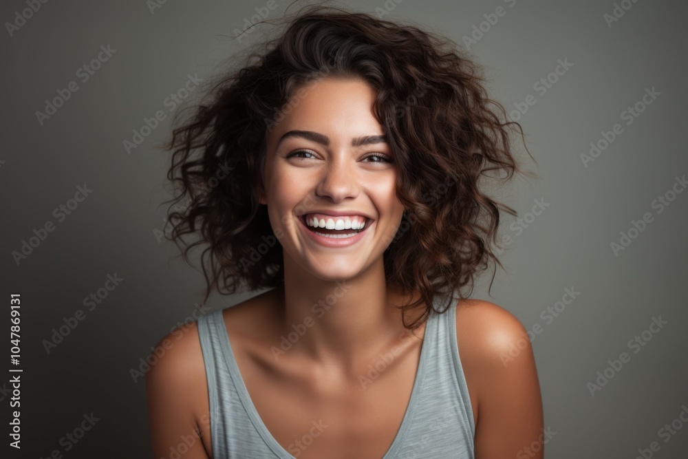 happy smiling young woman, neutral background happy smiling young woman, neutral background