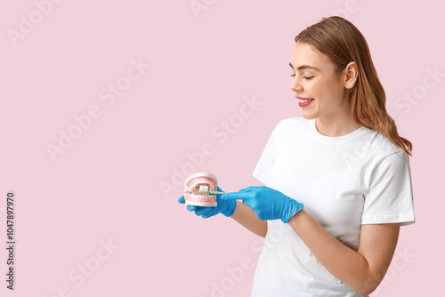 Female dentist with jaw mod...