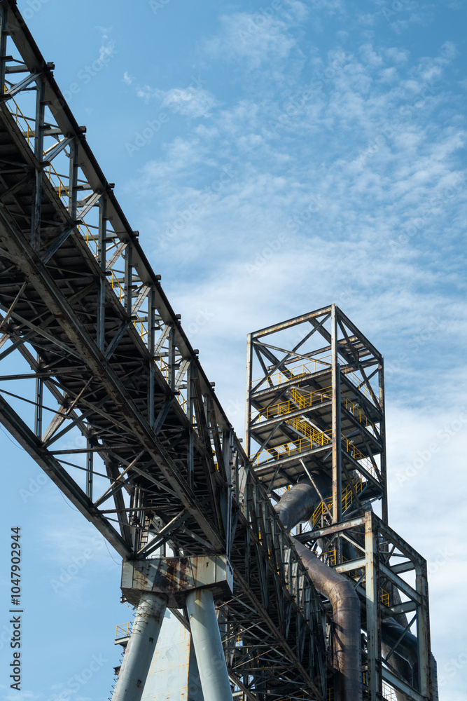Tall equipment at the steel plant under the blue sky. Tall equipment at the steel plant under the blue sky.