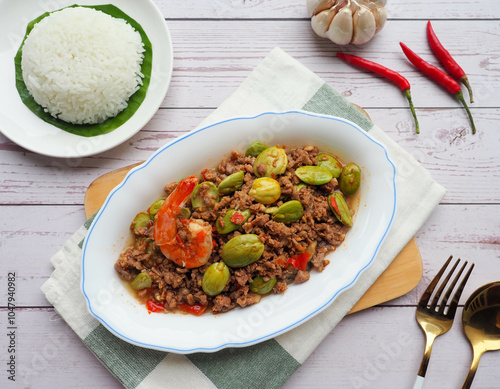 Stir fried bitter bean with minced pork and shrimp - Thai food called Sator at top view 