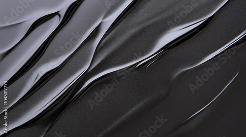 the fluid and dynamic nature of a black liquid.