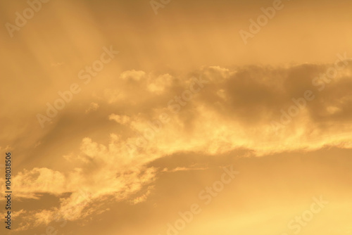 Orange And Yellow Colors Sunset Sky. Sunlight through clouds photo