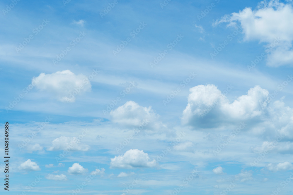 Clear blue sky texture and white fluffy cloud nature background. The sun shines bright in the daytime in summer. Clear blue sky texture and white fluffy cloud nature background. The sun shines bright in the daytime in summer.