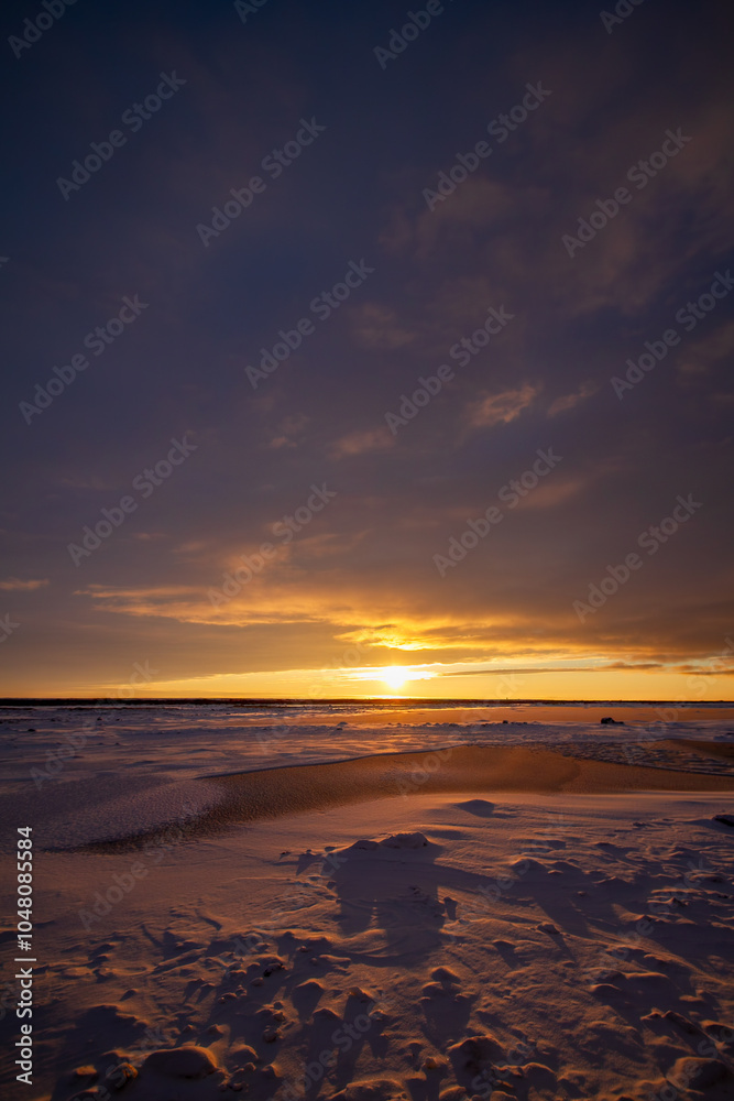 Stunning Winter Sunset Over Snow-Covered Landscape Stunning Winter Sunset Over Snow-Covered Landscape