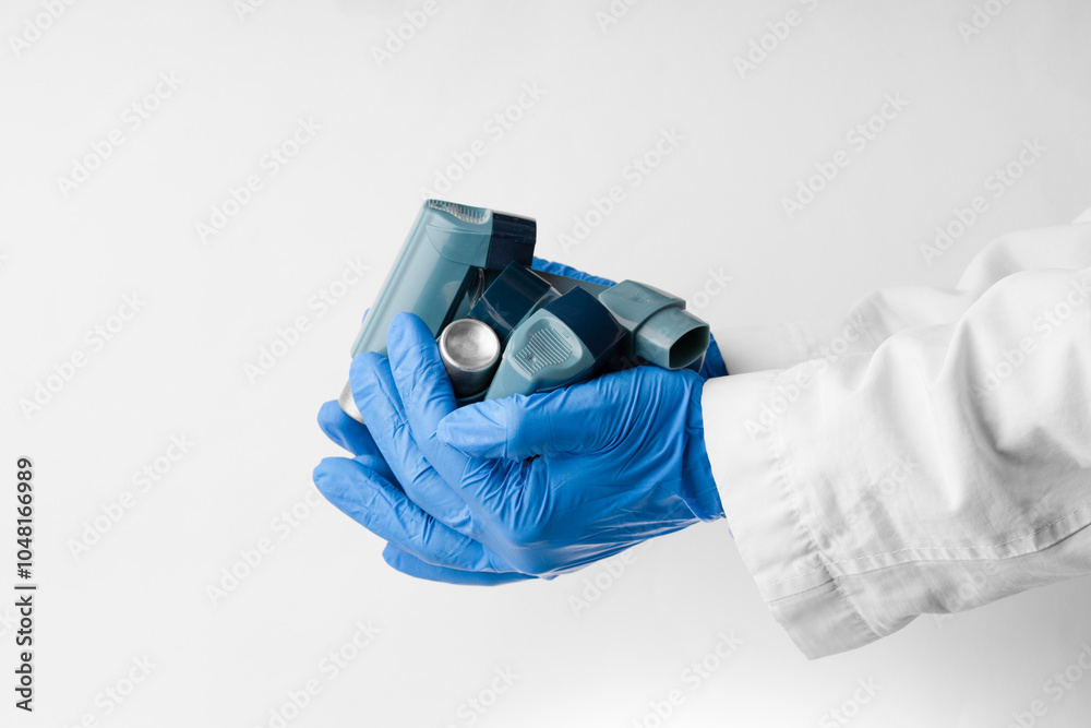 Doctor holding asthma inhalers . Disposal of medical waste concept . International Asthma Day