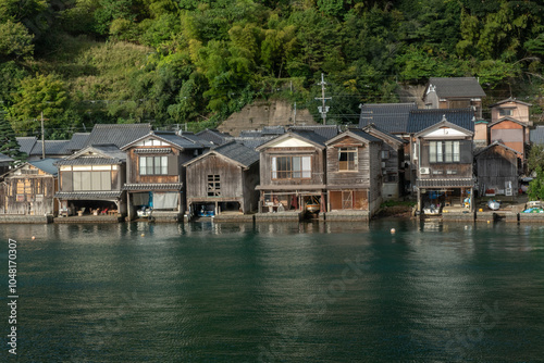 Funaya Boathouses in Ine fisherman village Kyoto Prefecture, The funayas were originally constructed to lift fishermen's wooden boats from the sea photo