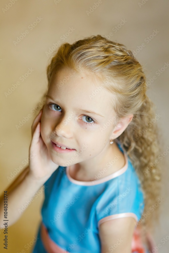 a little girl dressed in a red dress sitting in a room a little girl dressed in a red dress sitting in a room