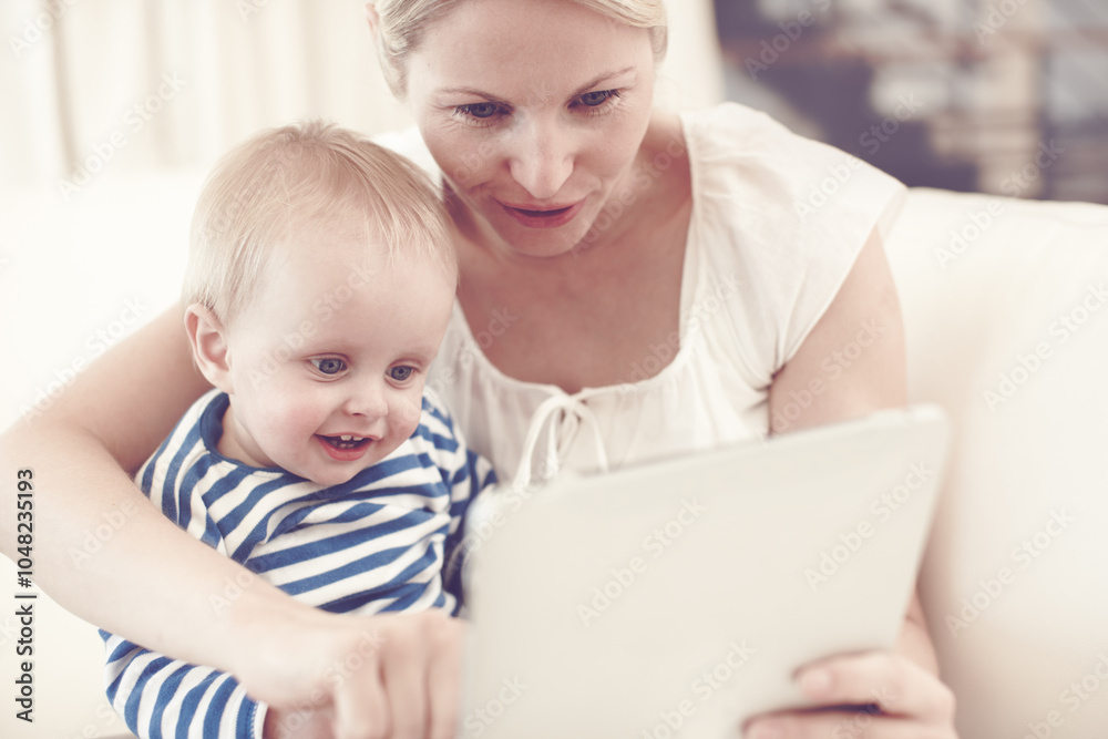 Home, mom and smile with toddler on tablet on sofa for streaming cartoons and online videos. People, parent and happy with kid on internet for educational games and entertainment for child growth Home, mom and smile with toddler on tablet on sofa for streaming cartoons and online videos. People, parent and happy with kid on internet for educational games and entertainment for child growth