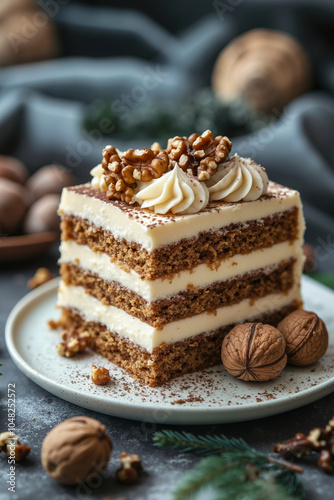 A slice of layered cake with white frosting and nuts on a white plate