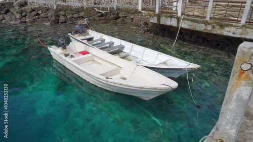 Two fishing boats at the harbour in Sabang Island. Tourist and divers boat at the dock in Rubiah Island Sumatera, Indonesia.
