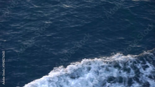 Ocean sea water splashing from the boat. Seascape from high perspective
