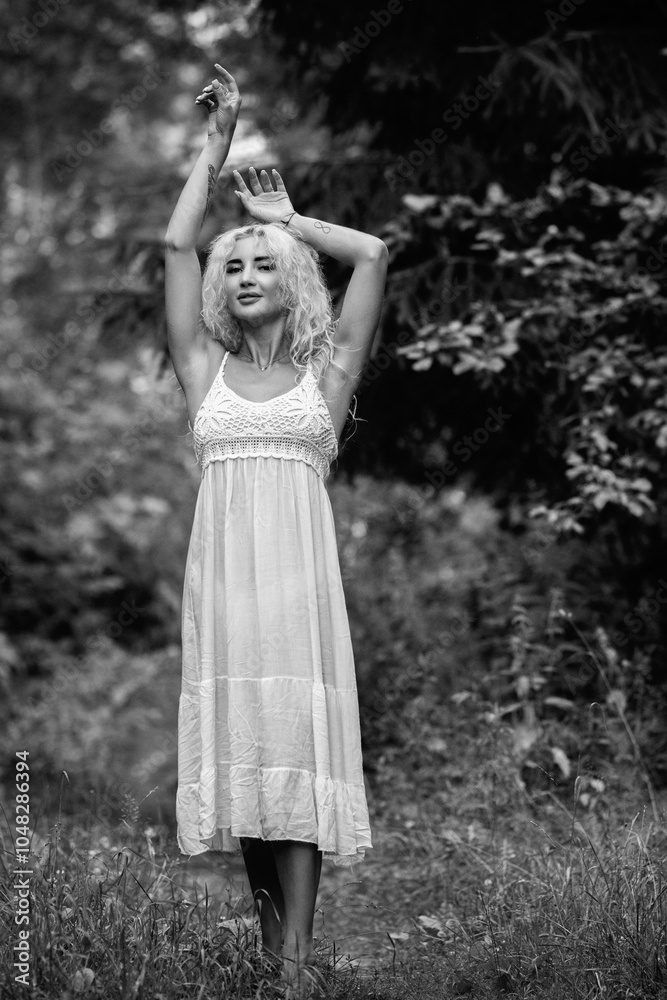 Portrait of a young beautiful blonde girl in nature. Black and white photo. Portrait of a young beautiful blonde girl in nature. Black and white photo.