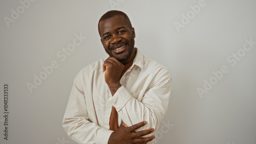 Handsome young man smiling over isolated white background