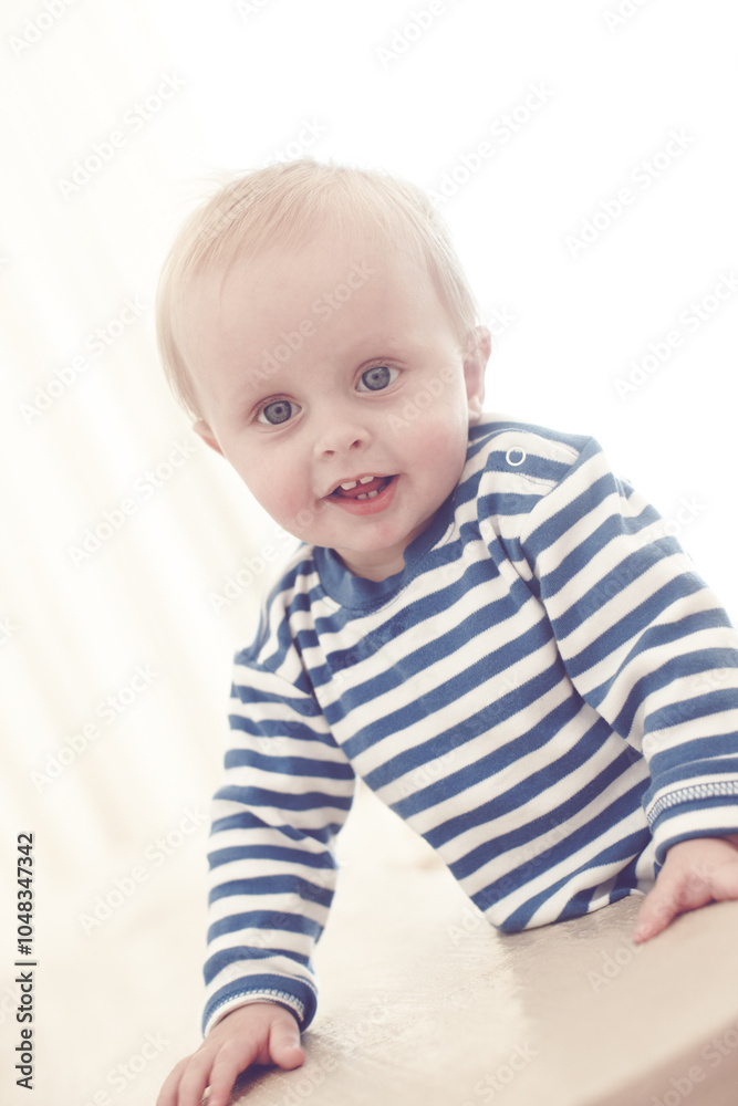 Baby, balance and child development in house for growth, motor skills and milk teeth as healthy boy. Male person, toddler and curious for learning, mobility and support in home as kid with happiness Baby, balance and child development in house for growth, motor skills and milk teeth as healthy boy. Male person, toddler and curious for learning, mobility and support in home as kid with happiness