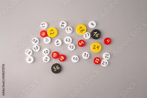 Obraz na plátně top view plastic bottle caps with hand-written numbers and multiplication facts on a gray background