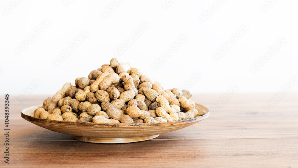 Many fresh unpeeled peanuts as background. Many fresh unpeeled peanuts as background.