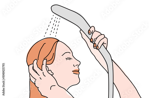 A woman smiling and holding the shower head on her head. She is relaxed.