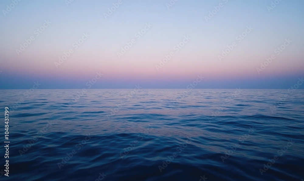 Fototapeta premium The ocean is calm and peaceful with a beautiful blue sky in the background