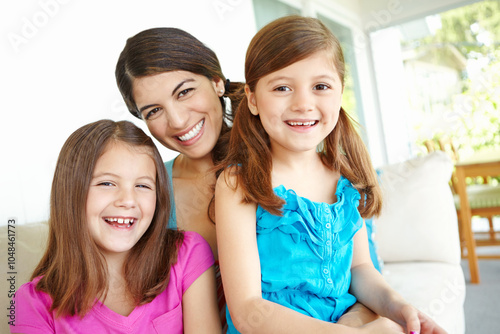 Home, smile and portrait of woman with kids for development, care and bonding together on weekend. Happy, daughter and mother with children in house for family connection, love and relaxing on sofa