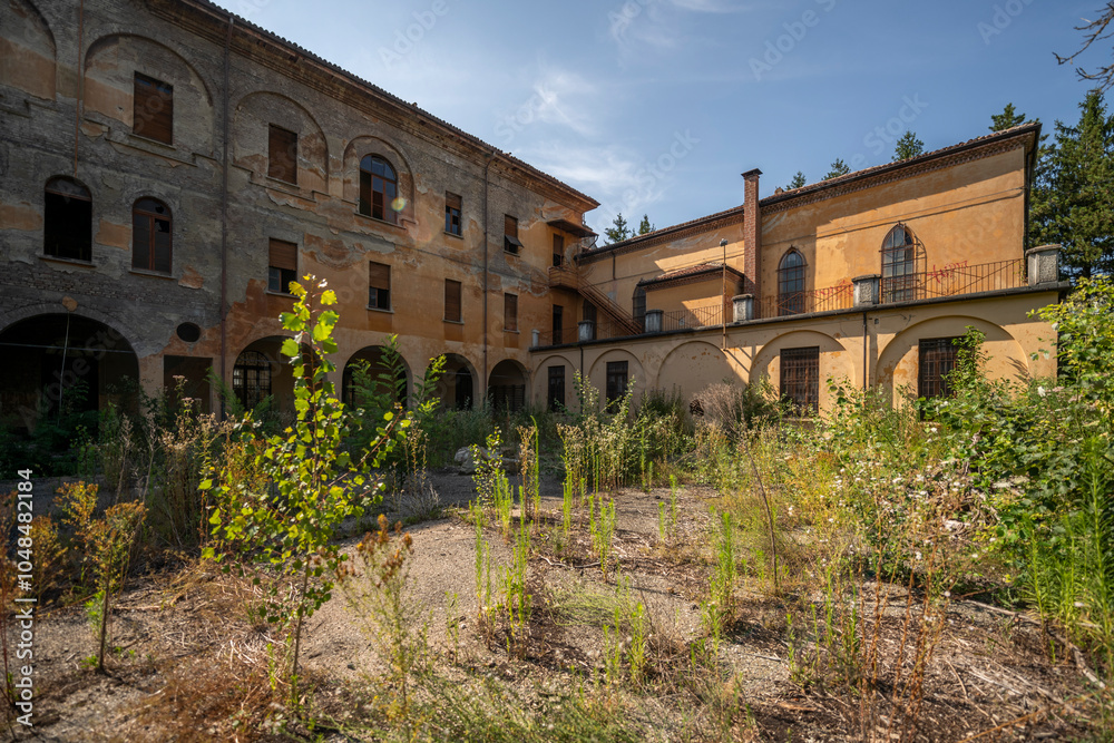 Fototapeta premium Forgotten Building in Northern Italy The Old Abandoned Seminary with a Blue Chapel