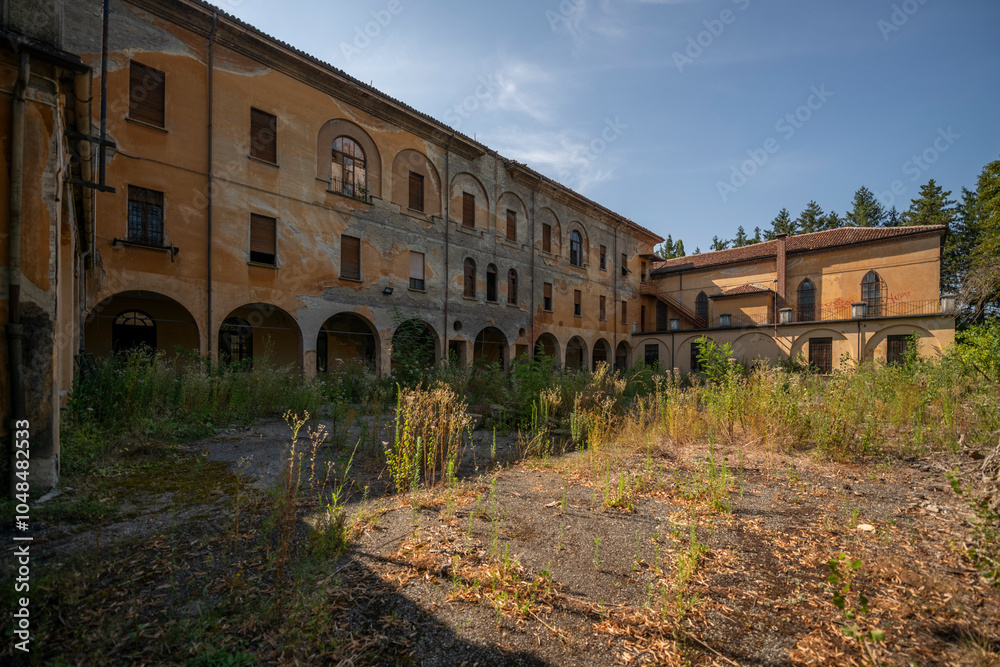 Fototapeta premium Forgotten Building in Northern Italy The Old Abandoned Seminary with a Blue Chapel