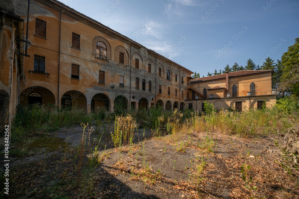 Fototapeta premium Forgotten Building in Northern Italy The Old Abandoned Seminary with a Blue Chapel