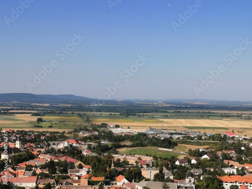 Landscape view with houses, agricultural fields and hills from the castle of Sümeg, Hungary