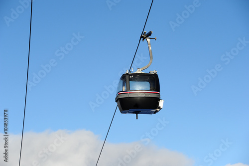 Vintage Ski gondola over the slopes of Courchevel ski resort, French alps