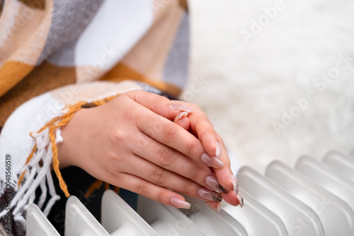 Wallpaper Mural Women's hands warming themselves near the heater Torontodigital.ca