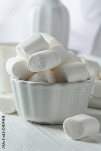 White marshmallows on a wooden table.