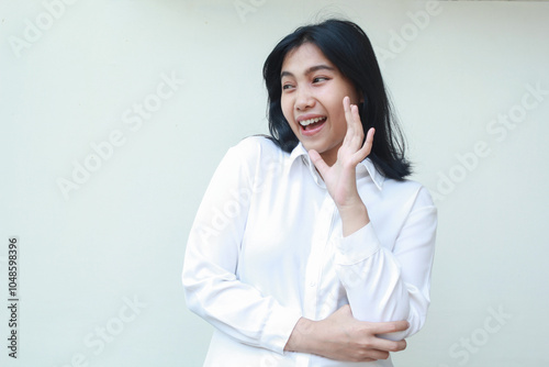 surprises excited friendly asian business woman raising hands say hi with folding arms looking away do welcoming gesture wearing white shirt formal suit standing isolated background