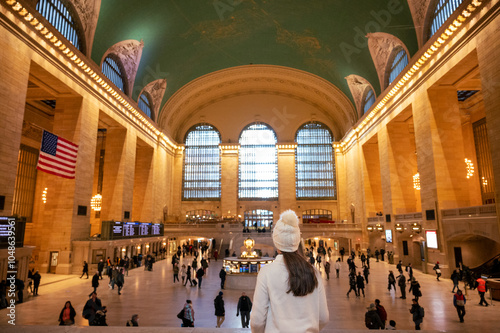 Girl dressed in white in central station in New York