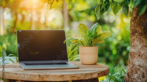 Garden setup with laptop under a tree, outdoor productivity, natureinspired work balance