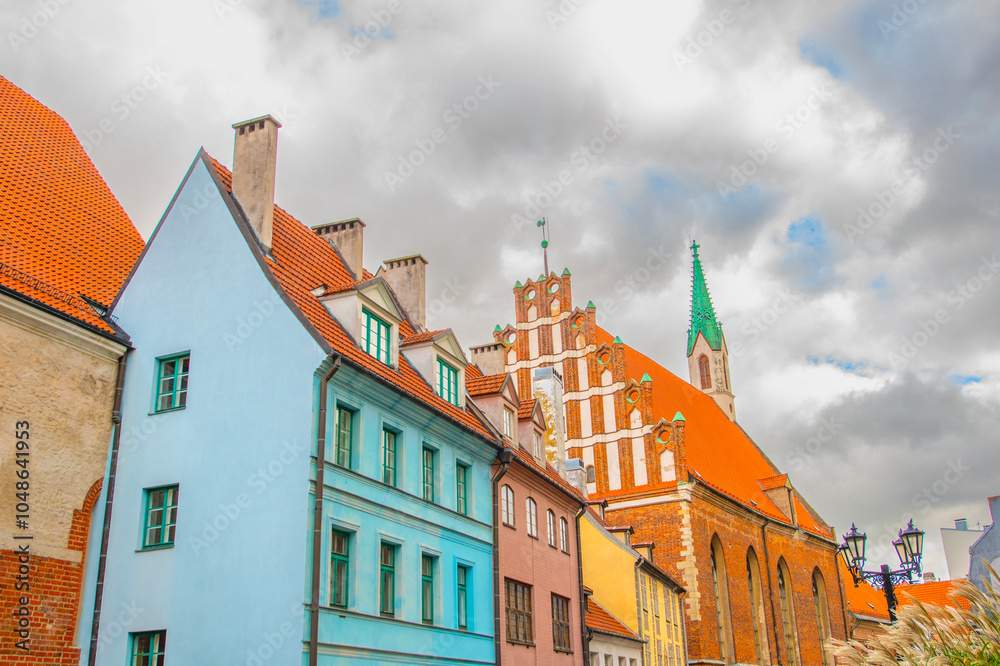 Obraz premium Old street in old Riga. The city is capital of Latvia that is well known to be a very popular tourism destination in the Baltic region