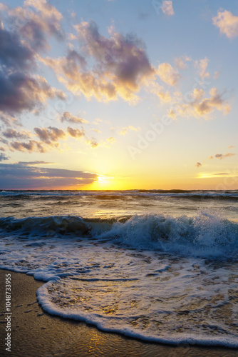 Seascape at sunset. Bright sundown on the sea shore. Sunset on the Baltic Sea.