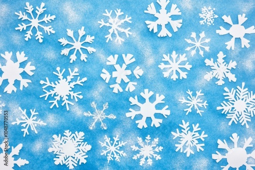 Close-up of delicate snowflakes on a vibrant blue background showcasing intricate patterns and details.