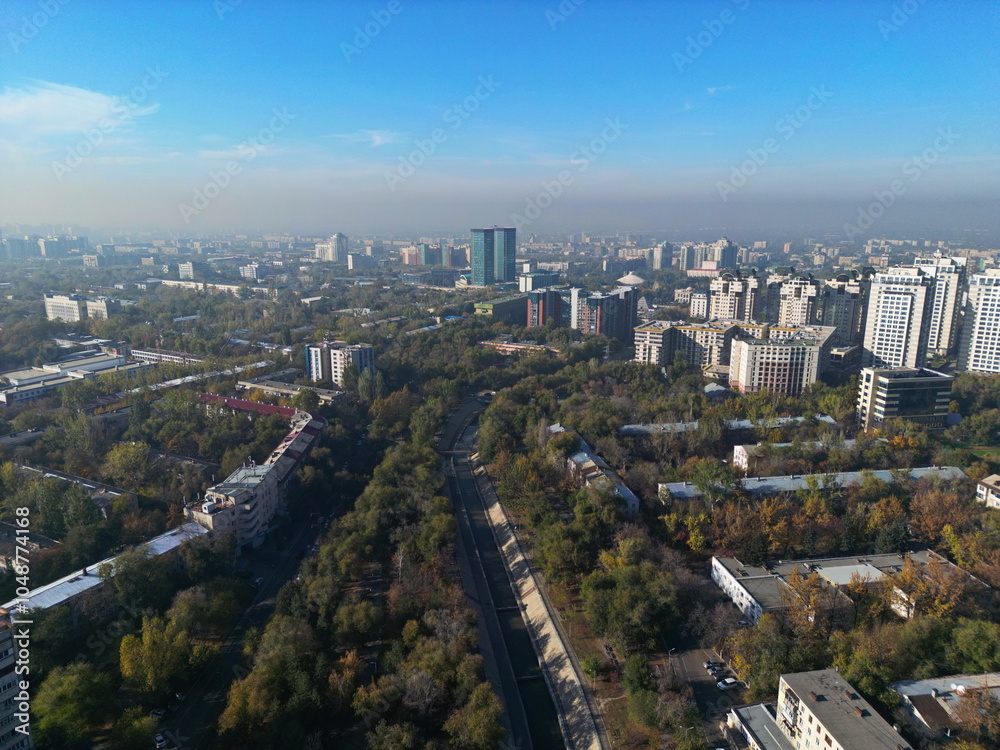 View of the city of Almaty with different houses and architecture. The view from the drone. View of the city of Almaty with different houses and architecture. The view from the drone.