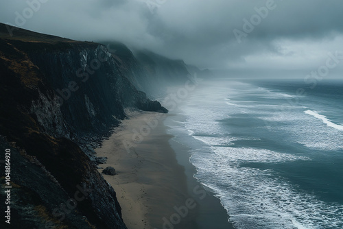 moody dark coastal cliff and waves in foggy weather