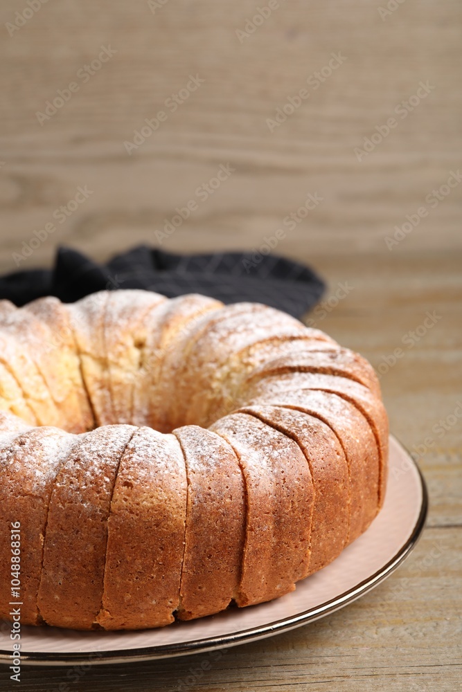 Freshly baked sponge cake on wooden table, closeup Freshly baked sponge cake on wooden table, closeup