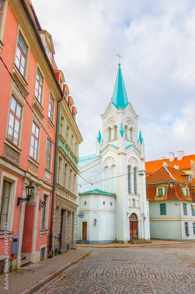 Obraz premium Old street in old Riga. The city is capital of Latvia that is well known to be a very popular tourism destination in the Baltic region