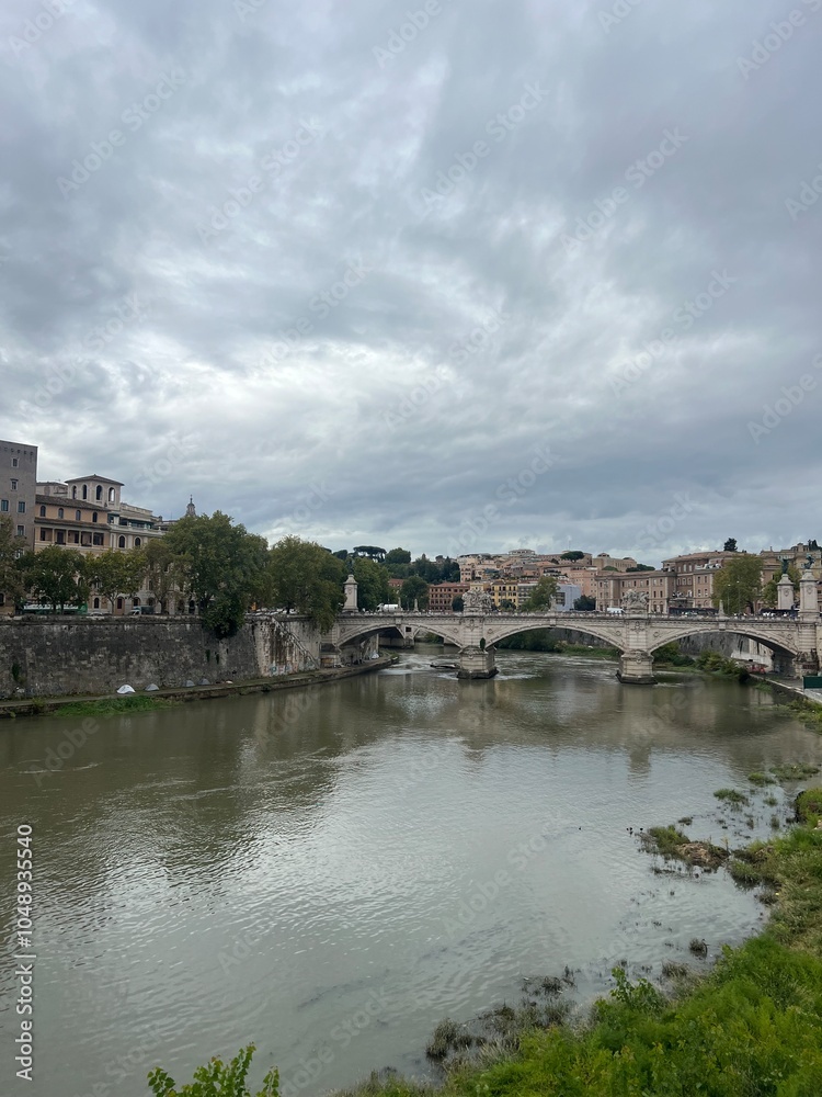 Fototapeta premium Waterfront city and bridge Rome