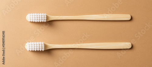 Bamboo toothbrush featuring a white handle set against a brown craft paper background in a flat lay style Zero waste eco friendly lifestyle Made from biodegradable material Vertical orientation photo