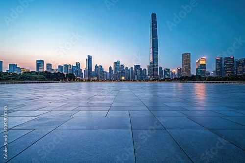 Empty square floor and modern city skyline at dusk in the background photo