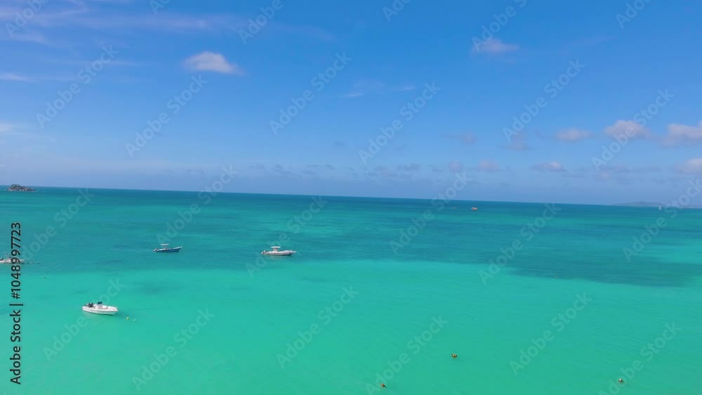 Praslin Beach, Seychelles. Aerial view of tropical coastline on a sunny day Praslin Beach, Seychelles. Aerial view of tropical coastline on a sunny day