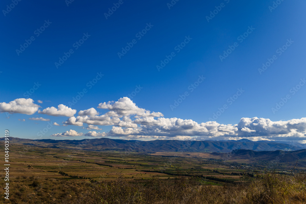 Sunny landscape with beautiful white clouds and settlements, Armenia-Georgia border Sunny landscape with beautiful white clouds and settlements, Armenia-Georgia border