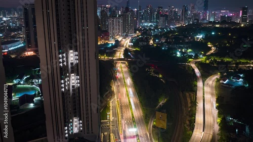 An establish aerial hyperlapse shot of Kuala Lumpur city overseeing the main four towers skyscrappers during morning photo