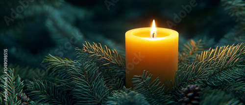 Burning Candle Surrounded by Green Pine Branches photo